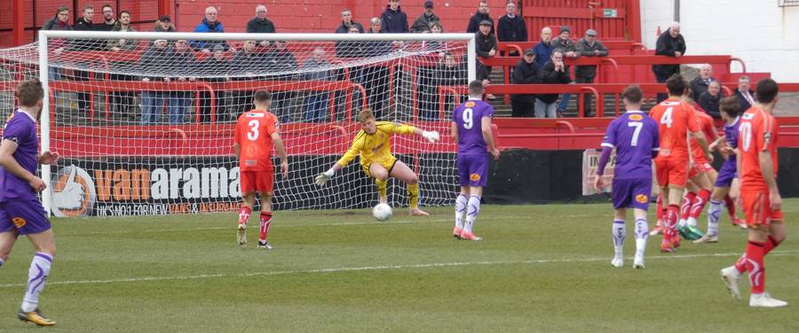 Tom Peers of Altricham in action with Claudio Ofosu of Hartlepool