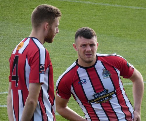 Tom Peers of Altricham in action with Claudio Ofosu of Hartlepool