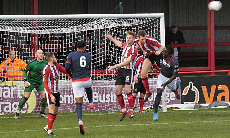 Tom Peers of Altricham contests a header with David Ferguson of Hartlepool  United during the Vanarama National League match between Hartlepool United  and Altrincham at Victoria Park, Hartlepool on Tuesday 27th October