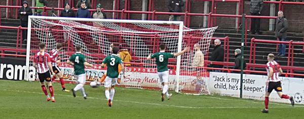 Tom Peers of Altricham in action with Claudio Ofosu of Hartlepool