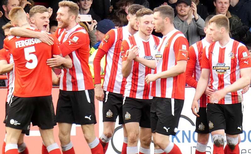 Director Sam Mackenzie congratulates Jordan Hulme on becoming Alty